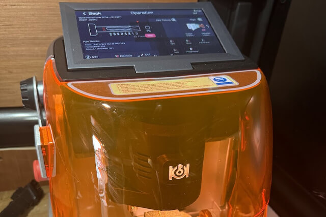 Wirral auto locksmith showing car key cutting machine