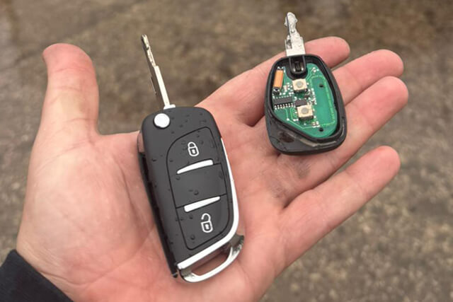 Blackpool auto locksmith holding brand new replacement vivaro car key