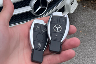 Beswick auto locksmith holding new replacement Mercedes car keys