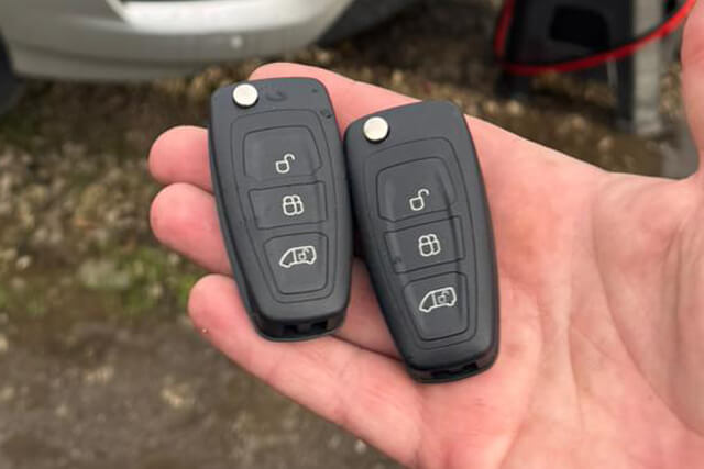Blackpool auto locksmith holding 2 brand new car keys for transit van