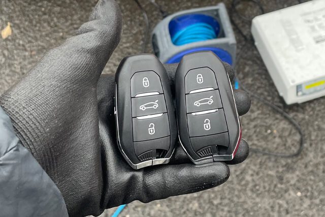 Beswick auto locksmith holding brand new vauxhall car keys