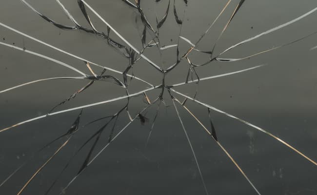 A smashed pane of glass in need of immediate repair