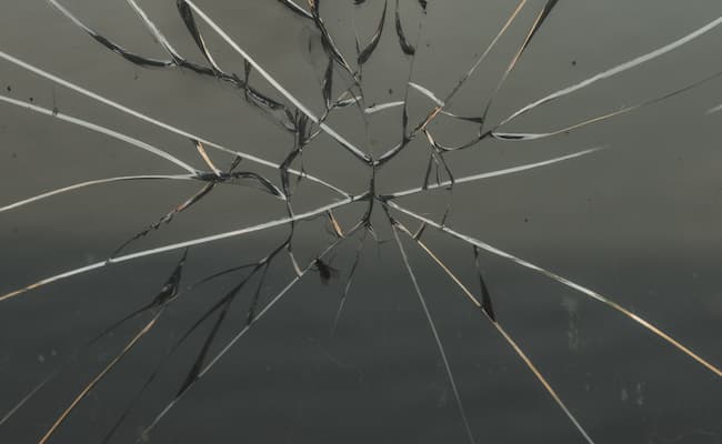 A smashed pane of glass in need of immediate repair