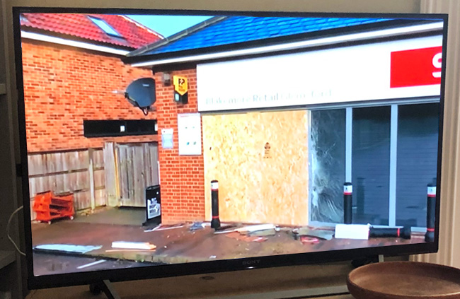 Shop front board up on TV