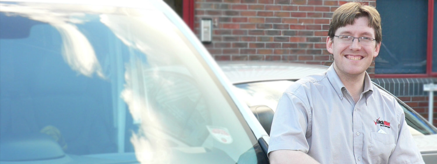 Exeter locksmith stood beside LockRite branded van