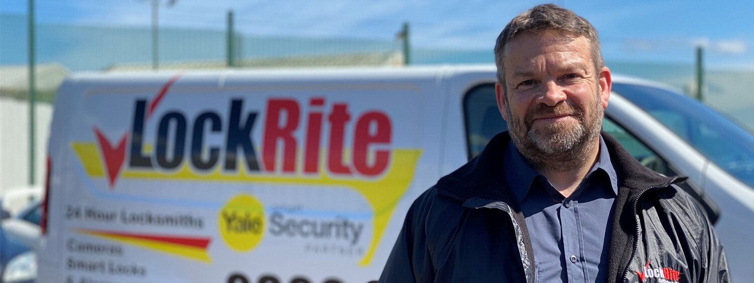 Saffron Walden locksmith stood beside LockRite branded van