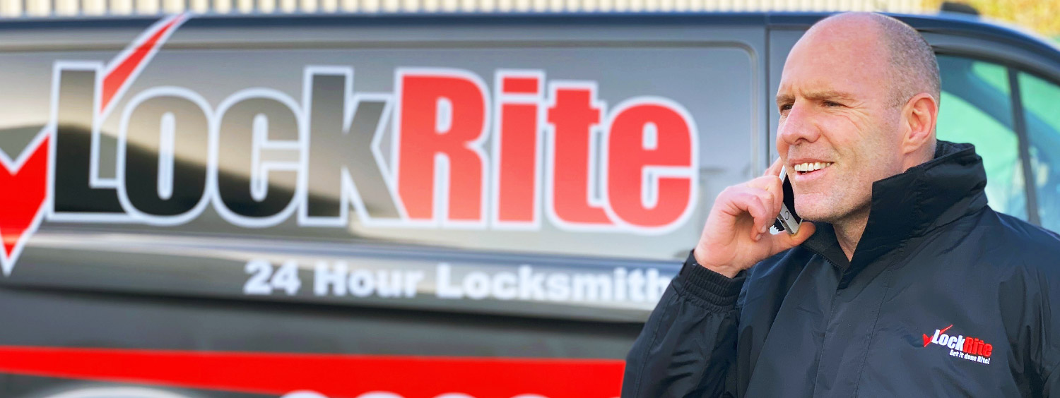 Epsom locksmith stood beside LockRite branded van
