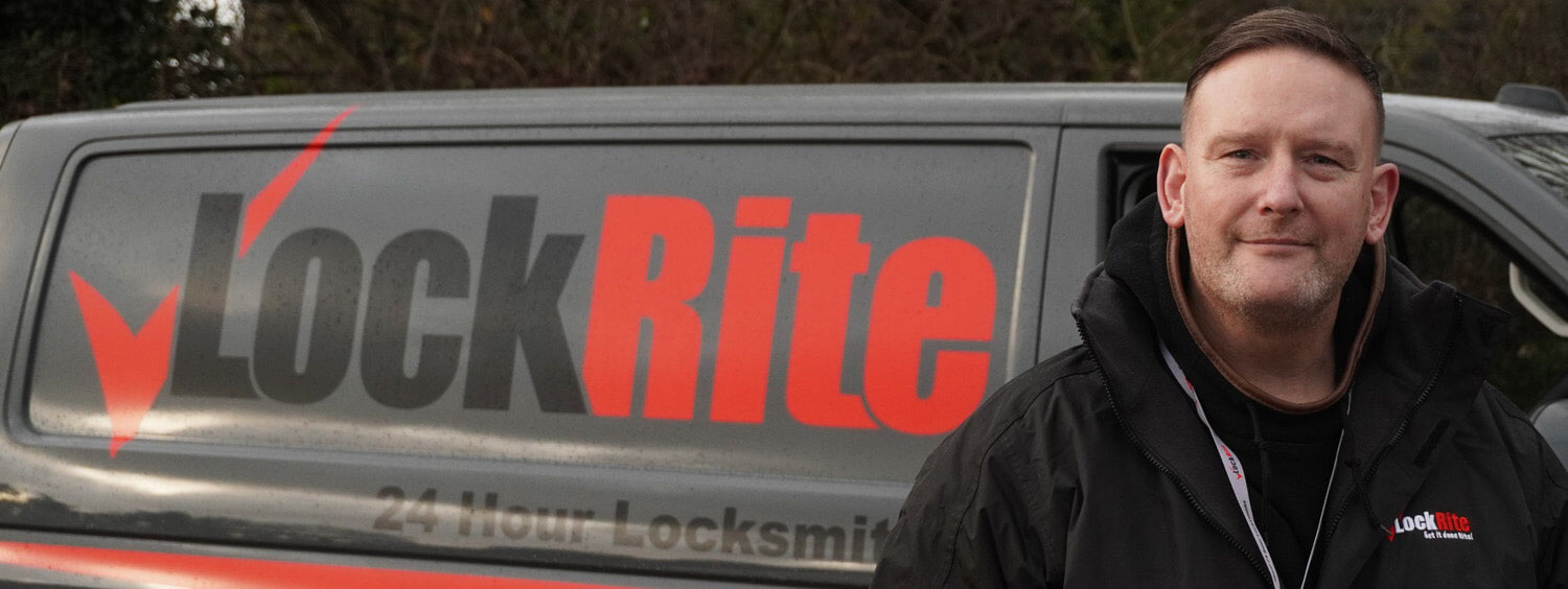 Truro locksmith stood beside LockRite branded van